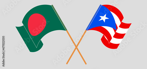 Crossed and waving flags of Bangladesh and Puerto Rico