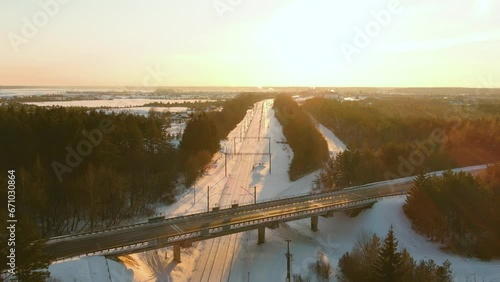 Wallpaper Mural Aerial sunset view of a railroad among pine forests at winter. Winter scenery in Vilnius, Lithuania. Torontodigital.ca
