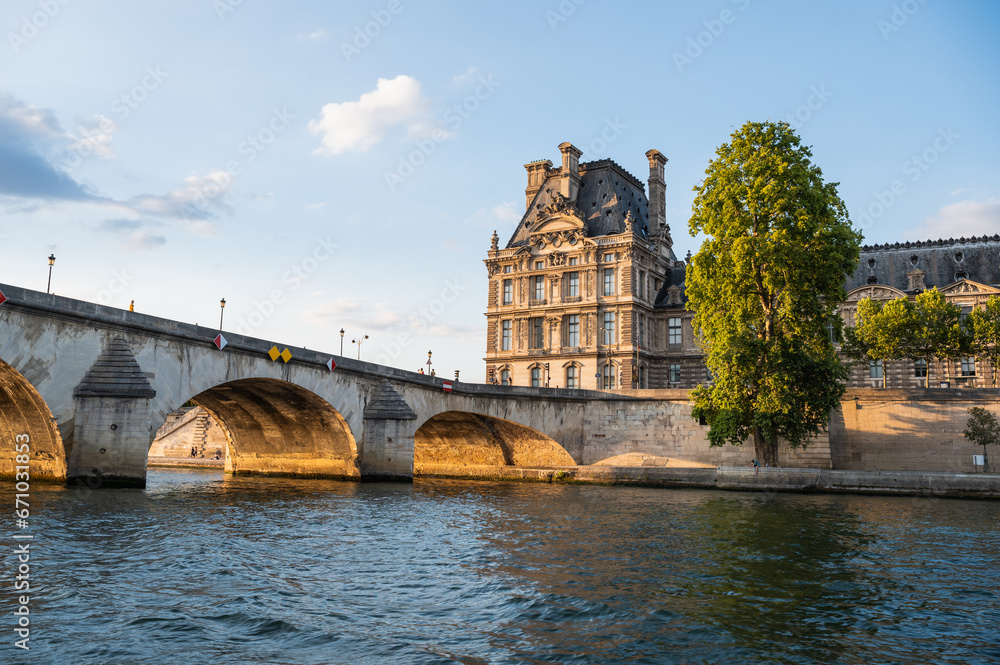 Pont Royal, five-arch bridge over river Seine in Paris, the third oldest bridge in Paris. View from the boat, evening light