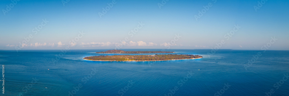 Tropical island in the blue ocean, Gili Travangan Lombok Indonesia, Panoramic aerial drone