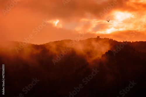 Spooky landscape, Furnas, Azores islands, mystical mountains with trees and fog. 