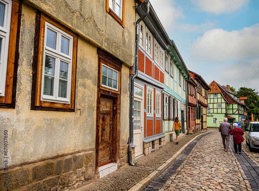 small town with old vintage small colored houses and old cobblestone pavement