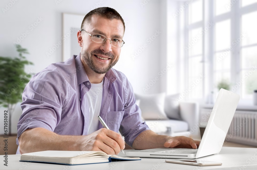 Happy smiling professional businessman sitting at office, AI generated image Happy smiling professional businessman sitting at office, AI generated image