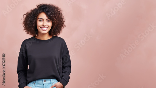 Afro american woman wearing black sweatshirt isolated on pastel