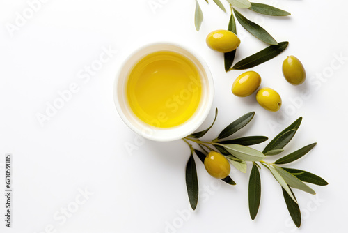 Olive oil in a bowl on white background