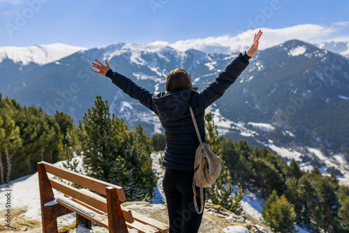 Tourist woman in Andorra, Europe. Winter snow landscape mountain view photo
