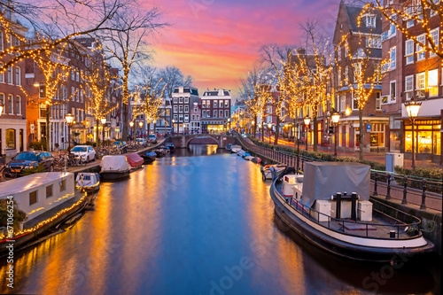 City scenic from Amsterdam at christmas time in the Netherlands at sunset