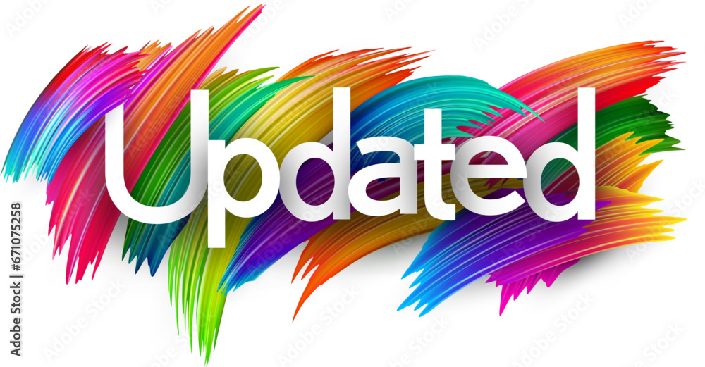Fototapeta premium Updated paper word sign with colorful spectrum paint brush strokes over white.