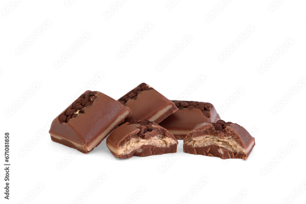 Broken piece of milk chocolate with filling and decorated with crumbs isolated on white background. Broken piece of milk chocolate with filling and decorated with crumbs isolated on white background.