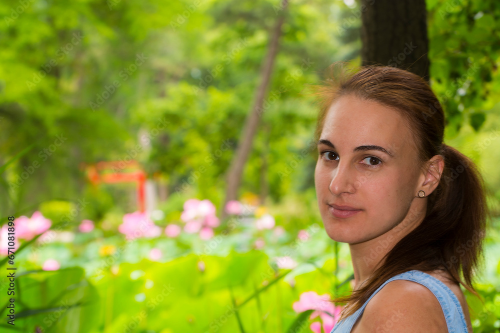 Portrait of a young woman in a botanical garden Portrait of a young woman in a botanical garden