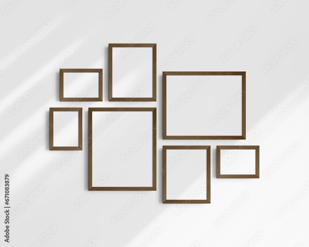 Gallery wall mockup set, 7 dark brown walnut wood frames. Modern frame mockup. Horizontal, vertical frames, 5x7 (5:7), 7x5 (7:5), 8x10 (4:5), 12x15 (4:5), 15x12 (5:4) inches. White wall with shadows. Gallery wall mockup set, 7 dark brown walnut wood frames. Modern frame mockup. Horizontal, vertical frames, 5x7 (5:7), 7x5 (7:5), 8x10 (4:5), 12x15 (4:5), 15x12 (5:4) inches. White wall with shadows.
