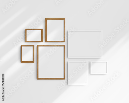 Fototapeta Naklejka Na Ścianę i Meble -  Gallery wall mockup set, 7 white and cherry wood frames. Modern frame mockup. Horizontal, vertical frames, 5x7 (5:7), 7x5 (7:5), 8x10 (4:5), 12x15 (4:5), 15x12 (5:4) inches. White wall with shadows.