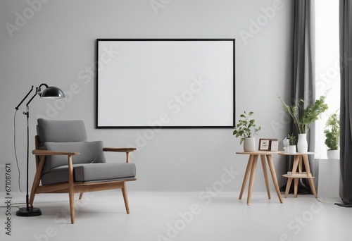 Wooden chair and gray sofa near white wall with big mock up poster frame on white wall Scandinavian