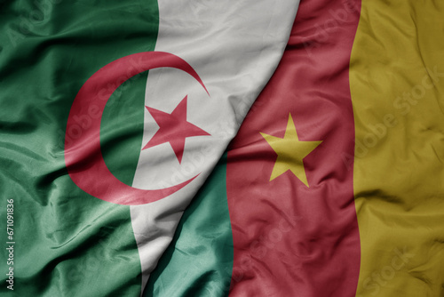 big waving national colorful flag of algeria and national flag of cameroon .