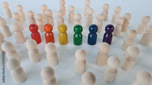 Quadro su tela Many white figurines and colored figurines as a symbol of diversity