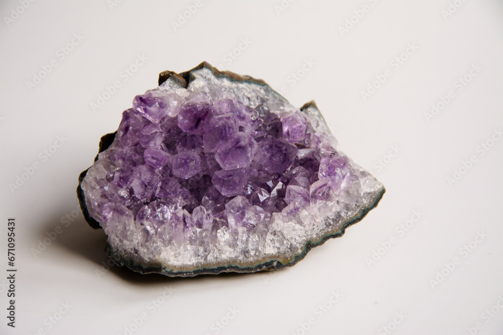 Amethyst stone mineral purple color on a white background Amethyst stone mineral purple color on a white background