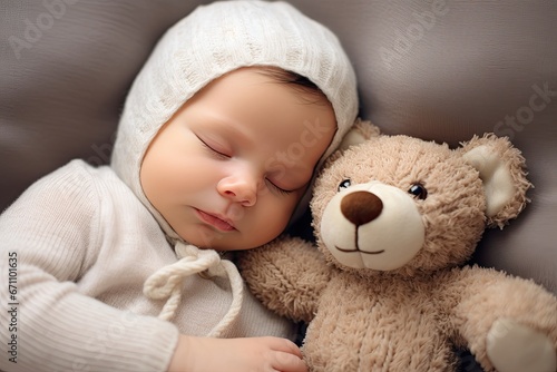 Cute newborn baby boy sleeps peacefully with his teddy bear, radiating innocence and calmness.