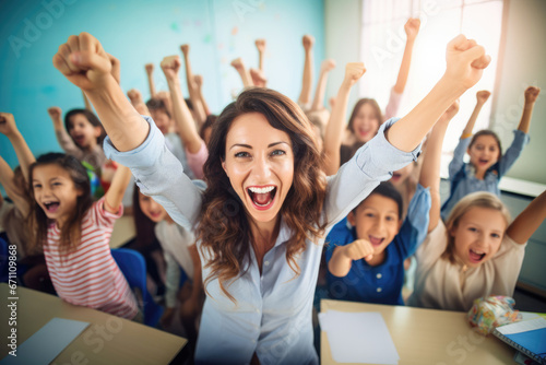 A joyful school classroom where a dedicated teacher interacts with her young students, fostering a positive and engaging learning environment. photo