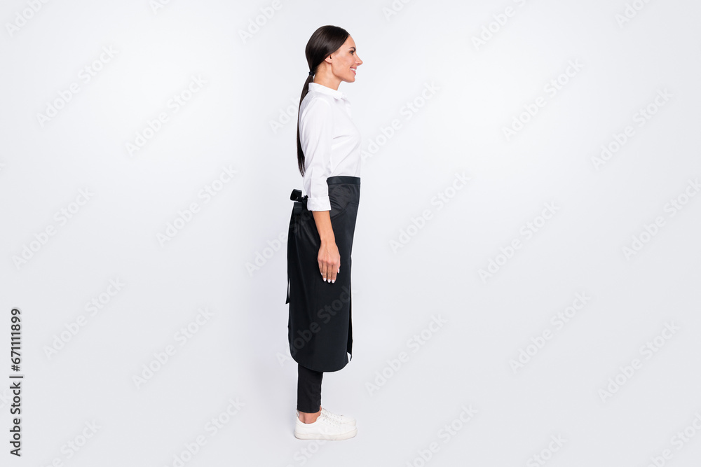Full length body size photo of smiling waitress looking empty space isolated on white color background Full length body size photo of smiling waitress looking empty space isolated on white color background