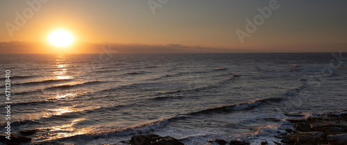 Seascape. Sunrise and waves. Golden light.