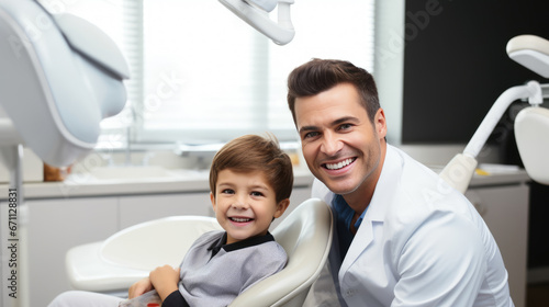 Smiling dentist and a small child at a dental clinic appointment