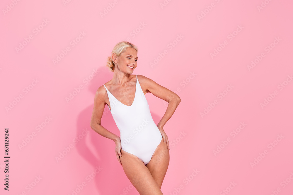 Photo of charming attractive retired lady morning routine wearing new white cotton lingerie isolated pastel color background Photo of charming attractive retired lady morning routine wearing new white cotton lingerie isolated pastel color background