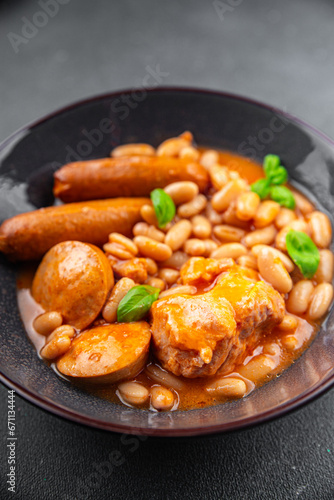 cassoulet thick bean soup with meat, beans, sausages delicious healthy eating cooking appetizer meal food snack on the table copy space