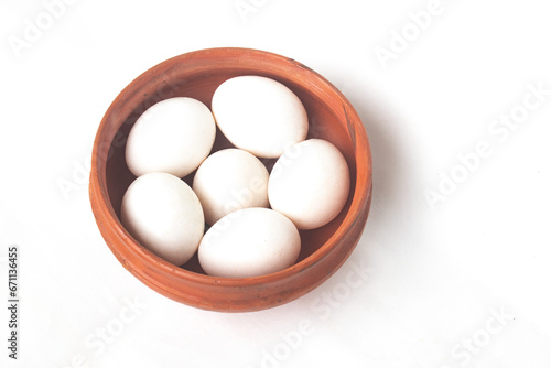 Eggs with white color shell in bowl on isolated white background. White Eggs.