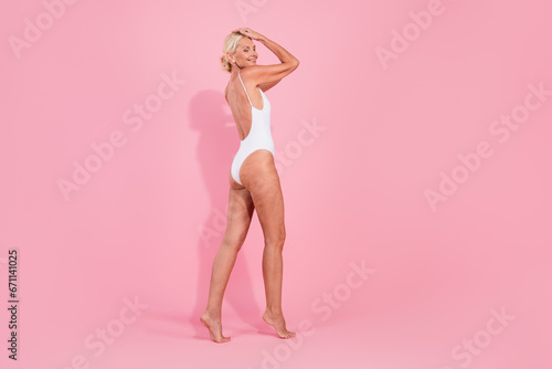 Photo of charming attractive pretty lady walking enjoy her body concept isolated pastel color background