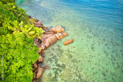 Bird eye drone of baie lazare beach, granite stones, turquoise water, coconut palm trees, sunny day, Mahe Seychelles 7
