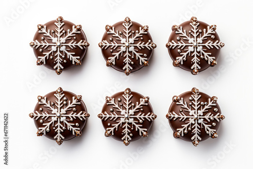 Festively detailed handcrafted chocolate snowflakes with glitter accents isolated on a white background 