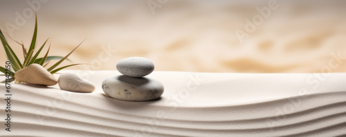 Stacked zen stones sand background art of balance concept photo