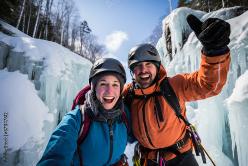 Thrilled couple conquering a shimmering frozen waterfall during exhilarating ice climb 