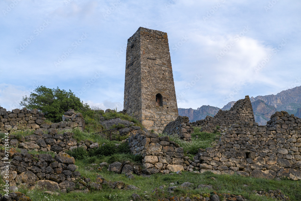 Ancient defensive tower on a early June morning. Tsmiti, Verhniy Fiagdon. North Ossetia Alania. Russian Federation Ancient defensive tower on a early June morning. Tsmiti, Verhniy Fiagdon. North Ossetia Alania. Russian Federation