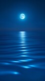 Night sky with full moon over the sea.