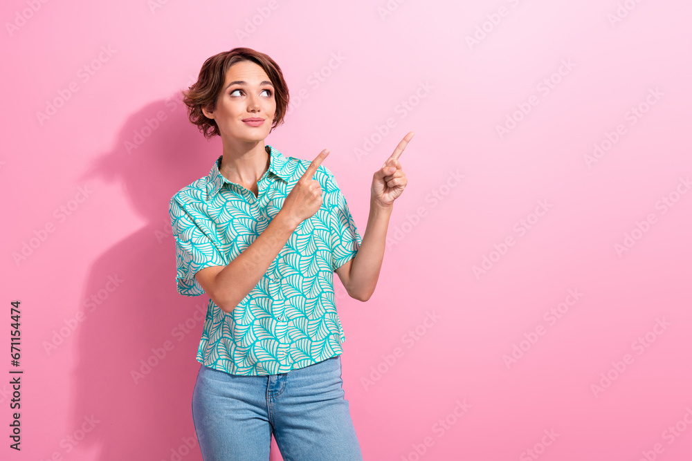 Portrait of interested promoter lady direct fingers empty space sale shopping wear shirt jeans isolated pink color background Portrait of interested promoter lady direct fingers empty space sale shopping wear shirt jeans isolated pink color background