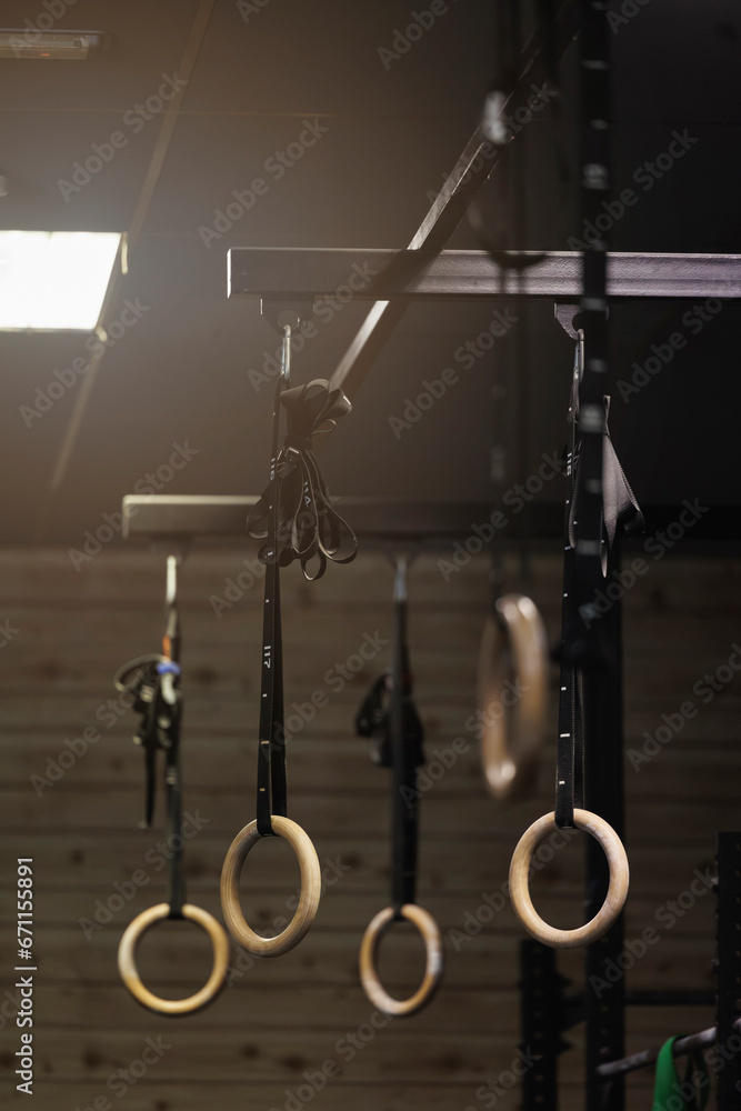 Gymnastic rings hanging in fitness gym