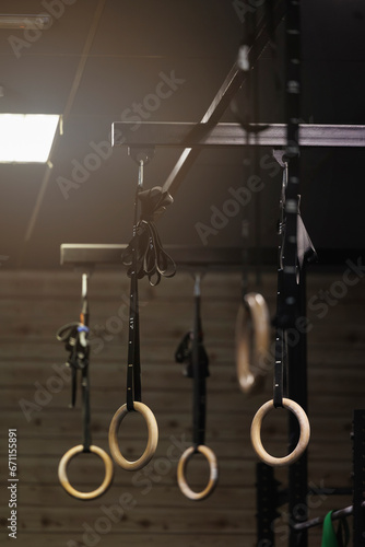Gymnastic rings hanging in fitness gym