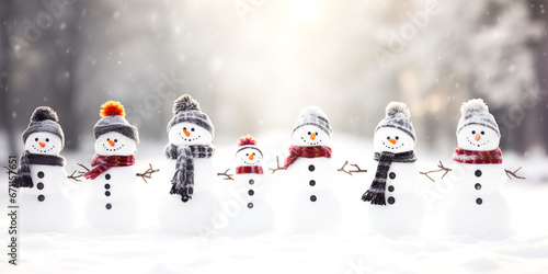 row of cute snowmen in winter