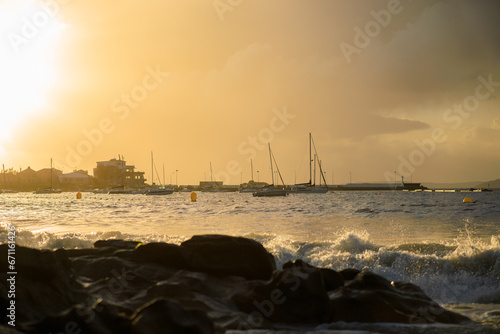 Vista del puerto deportivo de Aguete y el club de mar en Marín durante el atardecer.  photo