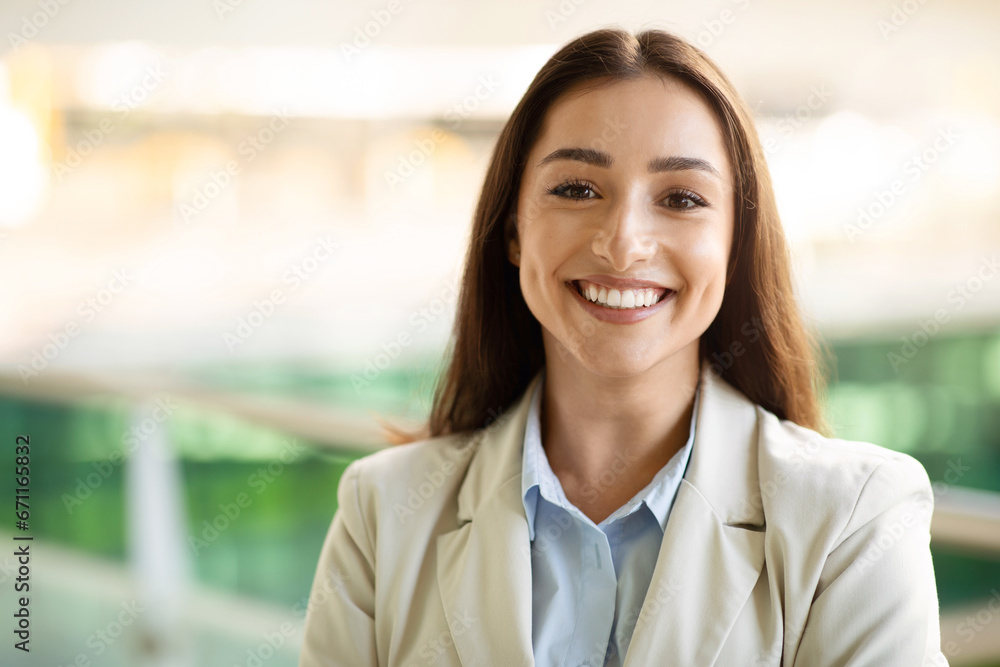 Headshot portrait of cheerful pretty confident young woman in suit enjoy work in city outdoors