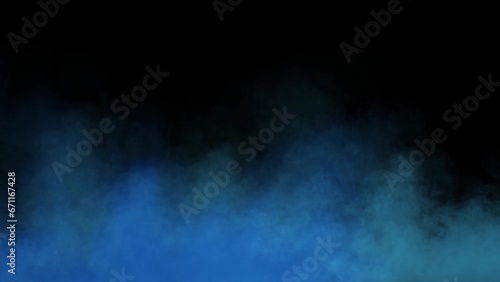blue fog in slow motion on black background. realistic atmospheric blue smoke on dark background. blue fume slowly floating rises up
 photo