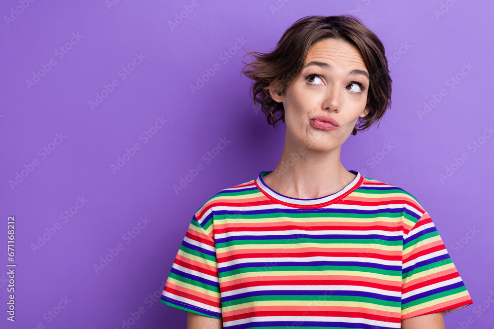 Photo of pretty minded lady look interested empty space contemplate isolated on violet color background Photo of pretty minded lady look interested empty space contemplate isolated on violet color background