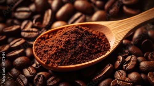 Coffee beans and wooden spoon with ground coffee close-up. photo