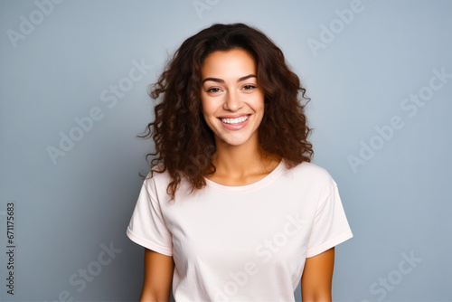 Woman with smile on her face and white shirt.