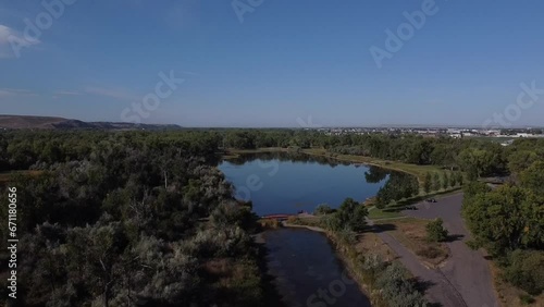 Aerial Footage of Pond in Montana with algae, Red Bridge, Summertime