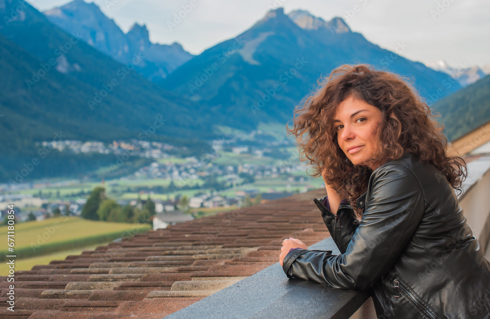 Latina woman on vacation in Alps mountains in Austria. Holidays and vacation concept