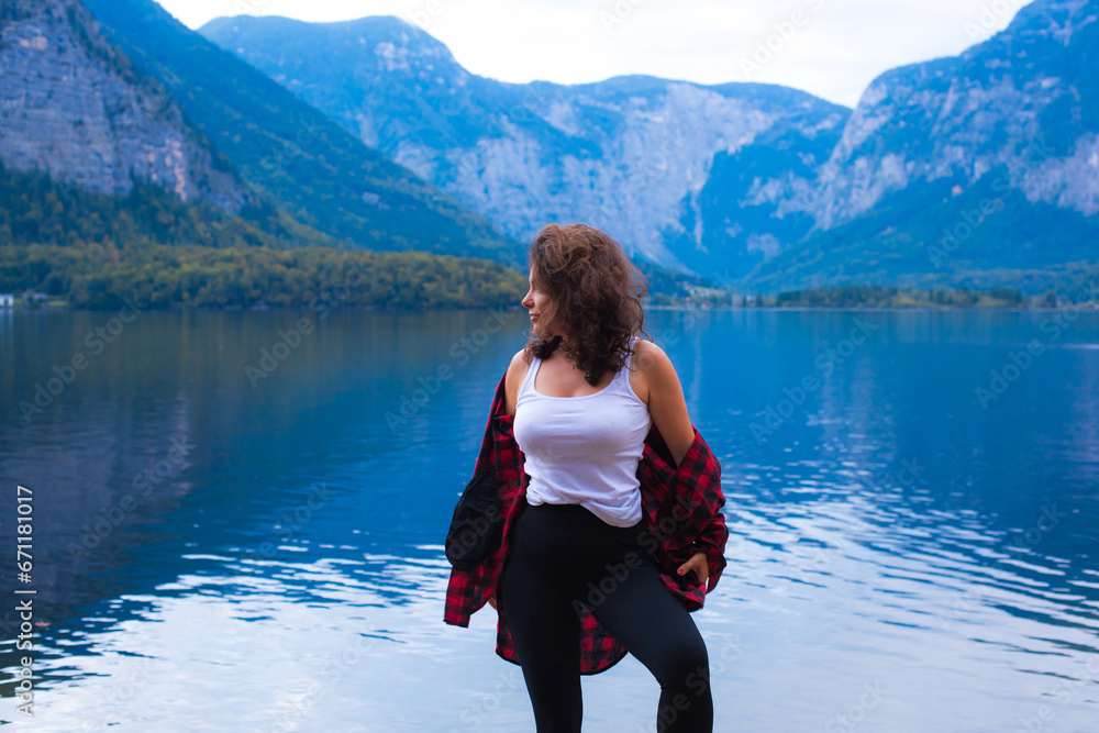 Fototapeta premium Latina woman on vacation in Alps mountains in Austria. Holidays and vacation concept