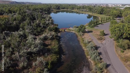 Aerial Footage of Pond in Montana with algae, Red Bridge, Summertime