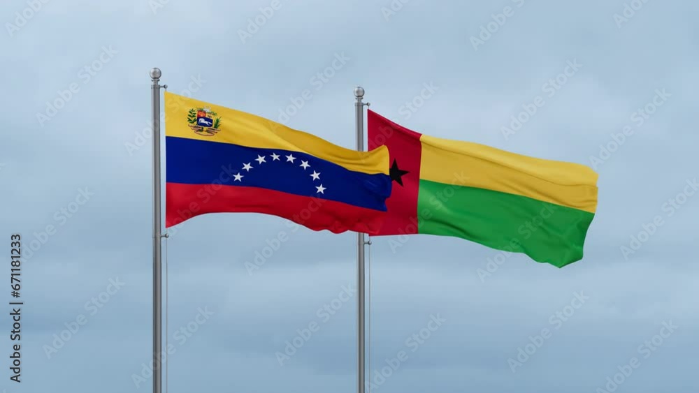 Guinea-Bissau flag and Venezuela flag waving together on cloudy sky, endless seamless loop, two country relations concept Guinea-Bissau flag and Venezuela flag waving together on cloudy sky, endless seamless loop, two country relations concept